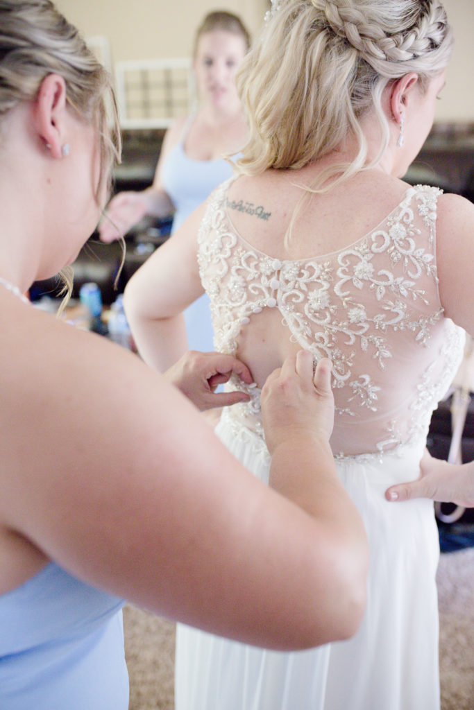 getting-ready-buttoning-dress