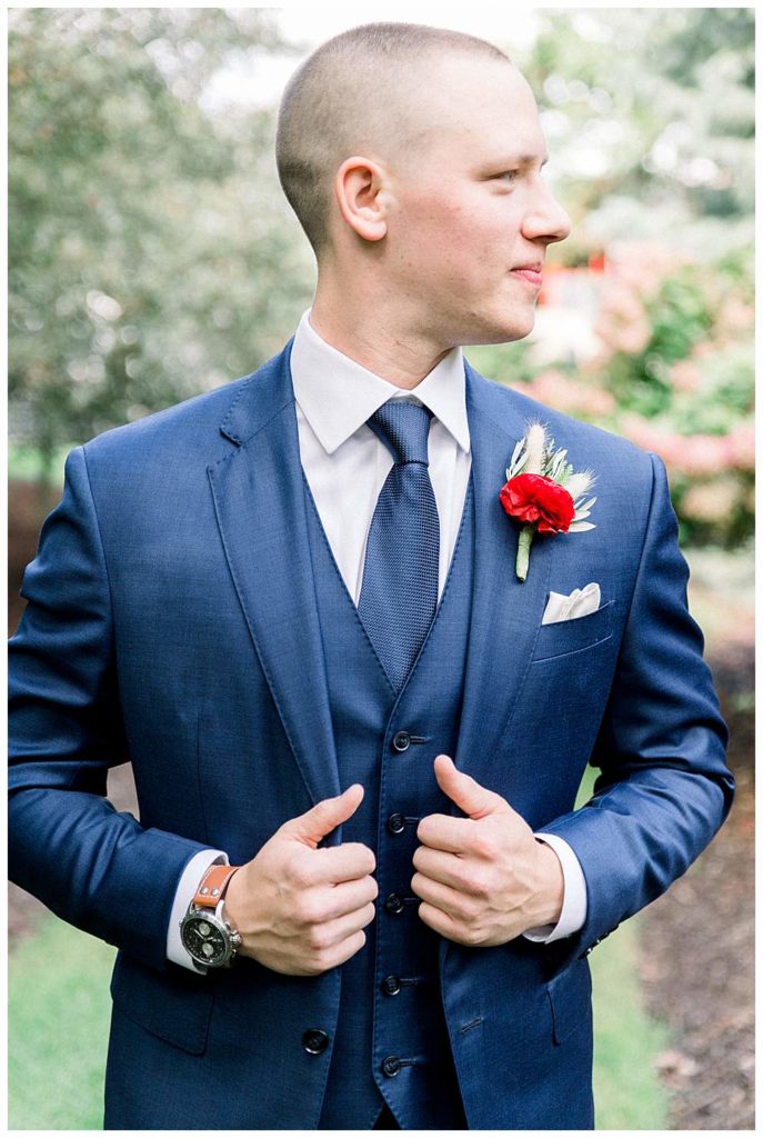 groom in navy blue tuxedo